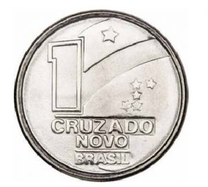 Braile na moeda de 1 Cruzado Novo que não chegou a ser lançado mas que tem a mesma configuração das peças futuras de 5, 10 e 50 cruzeiros. Além o sinal do número em si, há, à esquerda deste, o prefixo numérico (o L invertido).
